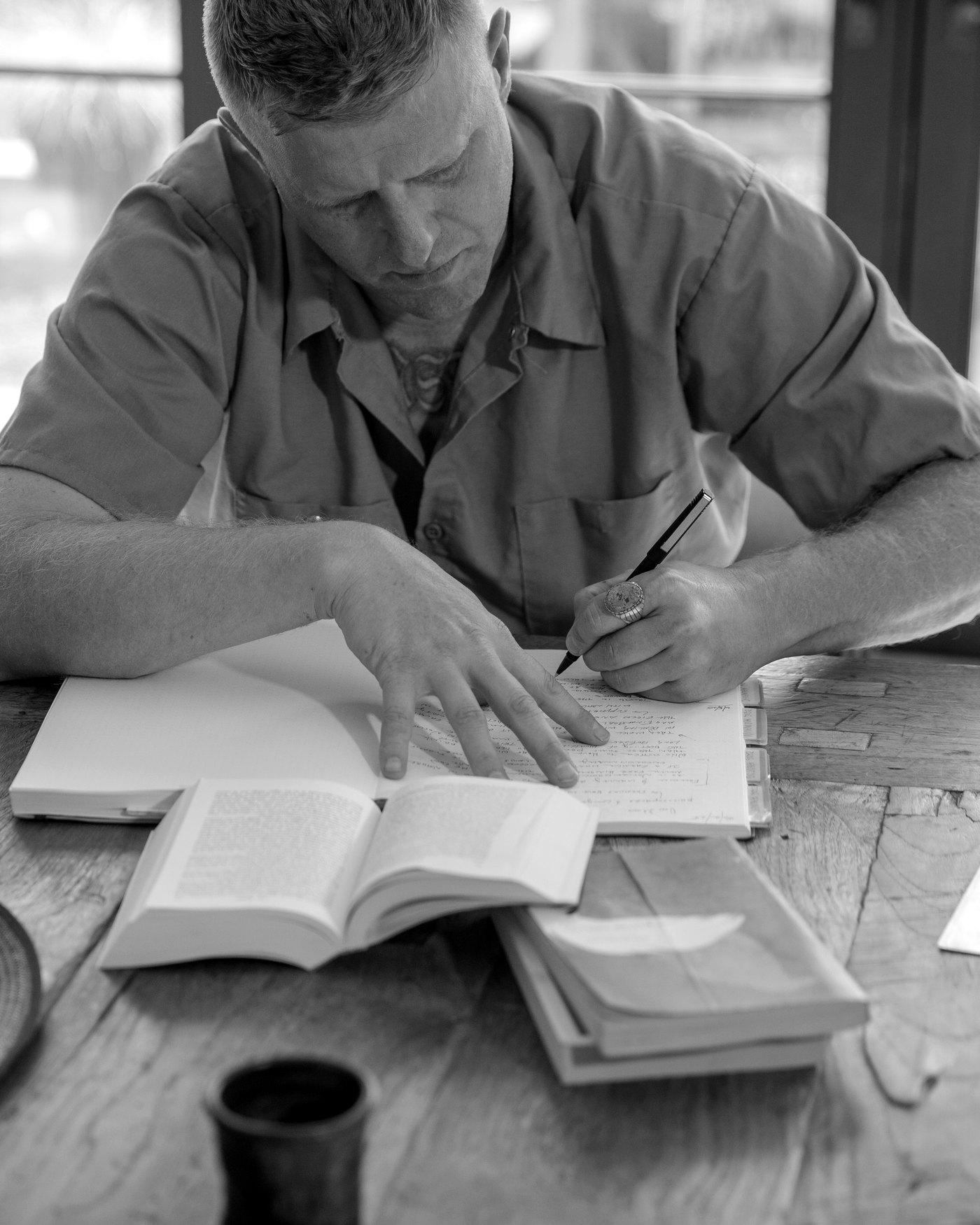 Andrew Schultz writing at the table
